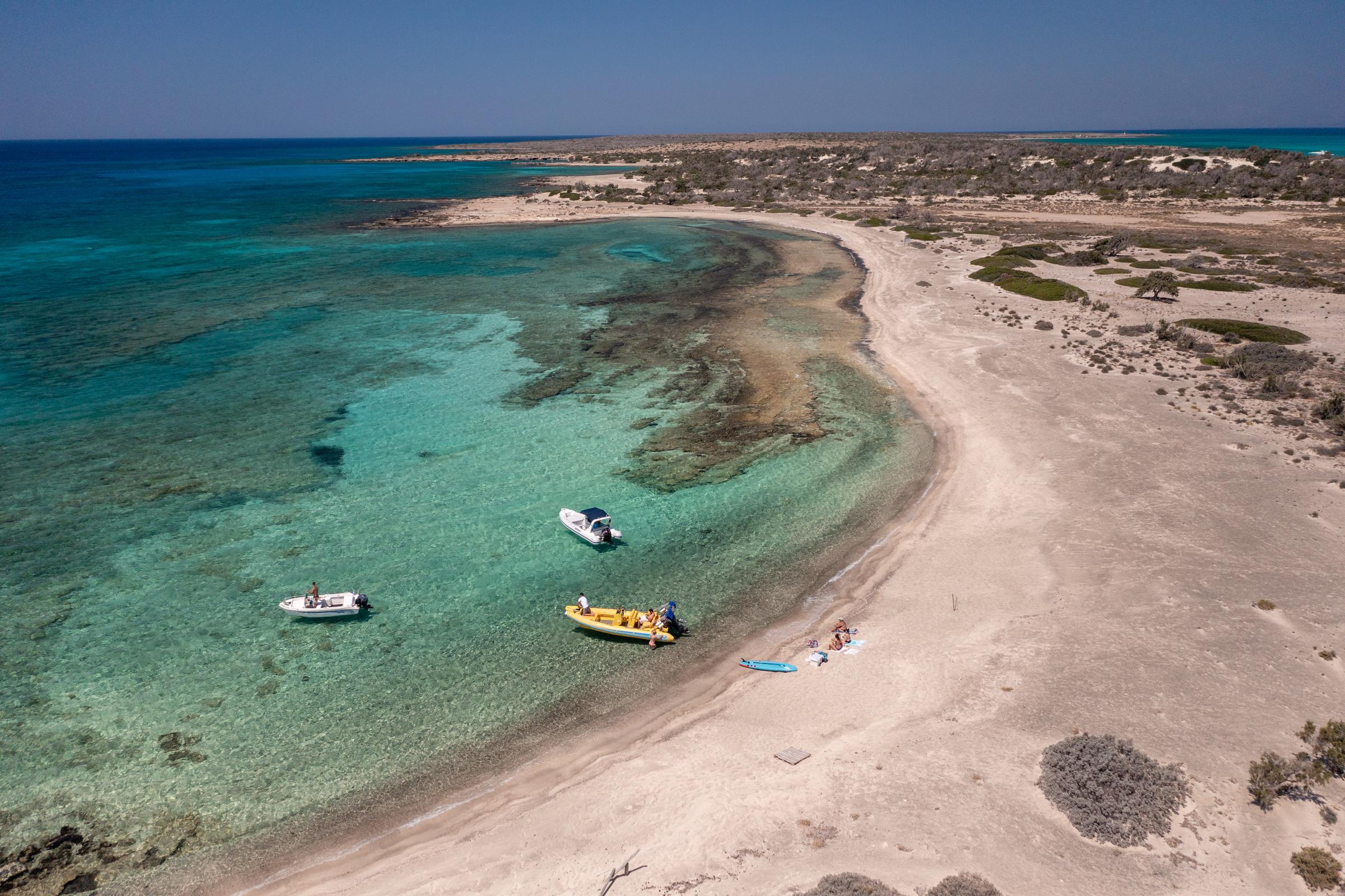 Chrisi island beach with boats